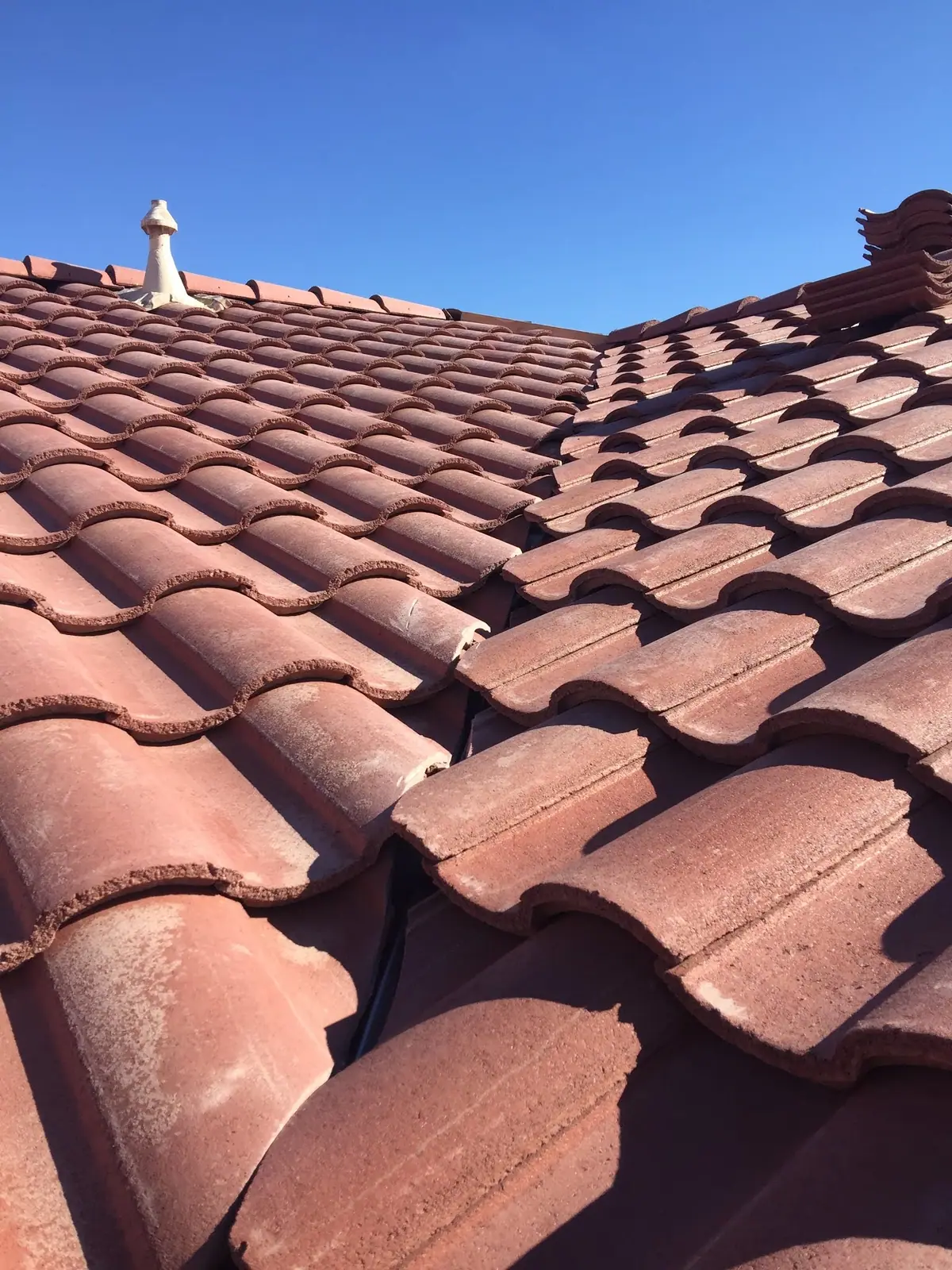 Close-up of terracotta S-tile laid in straight, even courses